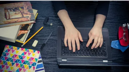 Image showing a pair of hands typing on a keyboard. 